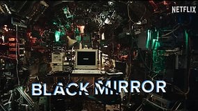 A cluttered room filled with wires and monitors, featuring a computer in the center. Text: 'BLACK MIRROR'.